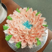 Watercolor Flower Water color cake with a big flower on top.