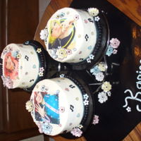 17Th Birthday Cake For My Granddaughter (A Cosplay/anime Enthusiast) Cakes are buttercream with edible images of the birthday girl in costume. Flowers and writing are fondant hand painted with pearl dust....