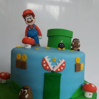 Mario Cake Layers of Lemon and raspberry cake with lemon curd and raspberry jam and buttercream between layers. Made for my and my husband's...