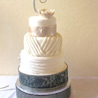 Pleats And Lace Fondant Cake This is my first attempt at such a dramatic cake. It has its flaws, but overall it was nice. The bottom tier is my first try at using the...