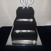 Black And Gray Wedding Cake Black square wedding cake with gray and bling accents.
