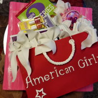 American Girl Cake I made this for my beautiful granddaughters' birthday! Her favorite chocolate cake inside the shopping bag. Shopping bag, tissue paper...