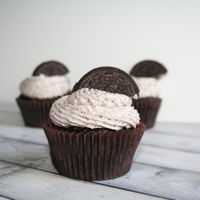 Cookies And Cream Cupcake Chocolate cupcake with crushed oreos mixed in. Topped with oreo buttercream frosting.