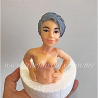 Going Topless One of my practice pieces. I endeavor to achieve more realistic features on my sugar figurines.