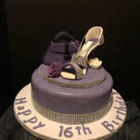Sweet Sixteen Theme Cake Sweet Sixteen Theme Cake vanilla flavored filled with raspberry flavored frosting. Shoe and purse were made out of gumpaste...