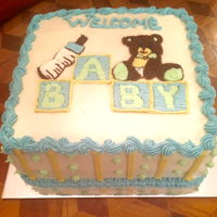 Baby Shower Cake Double layer chocolate cake filled, frosted and decorated with buttercream frosting. Made this for a co-worker's baby shower. TFL!