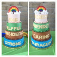Girl Scout Bridging Cake 4 tier cake decorated with buttercream and fondant letters, gumpaste cake topper.