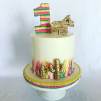 Fiesta Cake This was for a fiesta themed cake smash. Pi&ntilde;ata texture and glam donkey pi&ntilde;ata
