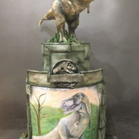 Jurassic World Cake This cake has a handmade dinosaur, handpainted scene and lots of airbrushing