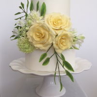 Straight Edge Cake With Yellow Roses Two tiers, double stack on top tier, straight edge cake with yellow roses & white sweet peas.