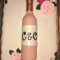 Wine Bottle Bridal Shower Cake Made this bridal shower cake based on the invitation used. Wine bottle and flowers are gumpaste and they are sitting on a red velvet sheet...