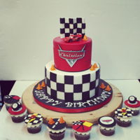 "cars" Birthday 2 tier fondant cake with coordinating cupcakes. Car was purchased.
