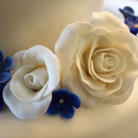 Royal Blue & White Wedding Cake 4-tier mike and white marbled fondant cake.