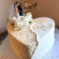 Wedding Cake Cornelli lace pipped heart shaped wedding cake. All vanilla !