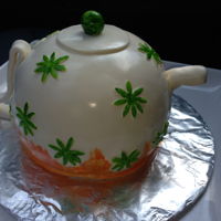 Teapot Yellow cake with fudge filling and covered with fondant.