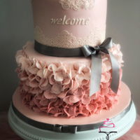 Baby Showe Ruffle Cake 2 tier ruffled fondant cake with fondant baby and edible lace.