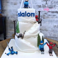 Ski Cake 3 tier carved ski cake with fondant skiers and fondant gondola