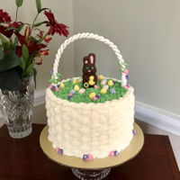 Easter Basket Cake Meyer Lemon layer cake with buttercream basketweave topped with chocolate bunny and eggs