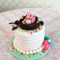 Easter Mini Cake Three layer 6&rdquo; round vanilla cake with buttercream frosting. Fondant bird and birds nest and flowers .assorted candies and...