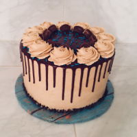 Reese Peanut Butter Cake Dark chocolate cake with peanut butter frosting and Reese peanut butter cups between layers and frosted with peanut butter frosting and...