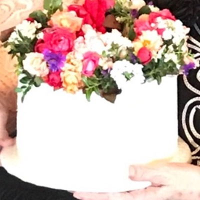 White Buttercream Cake With Fresh Floral Wreath