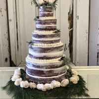 Red Velvet Wedding Cake Red velvet cake with cream cheese frosting. It was frosted in the naked style and has candied cranberries and candied rosemary.