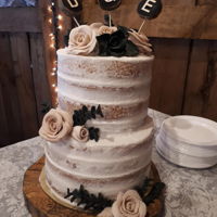 Naked Wedding Cake 2 tier vanilla Wedding cake covered in rich Buttercream frosting. Decorative accents are made of Marshmallow Fondant formed into delicate...
