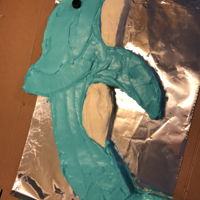 Dolphin Carrot cake with cream cheese. First time decorating with cream cheese icing