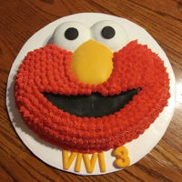 Vivienne, 3 Years Old, Likes Elmo Buttercream frosted Elmo. Wilton's Cake pan. These pans are so fun to use! Fondant eyes and candy clay nose and mouth.