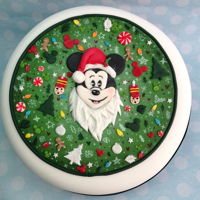 Disney Christmas Cake Fruit cake with marzipan and icing and Disney inspired decoration.