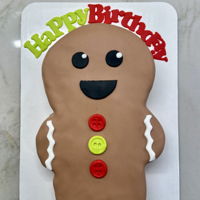 Gingerbread Man Cake Fondant covered cake with fondant decorations.