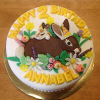 Annabel Loves Little Bunny Buttercream and fondant covered cake with candy clay and candy melt decorations.