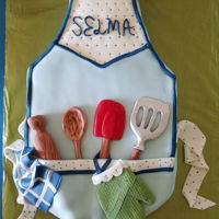Apron Cake Made from a 12x16 chocolate cake, covered in buttercream and fondant. All decorations are fondant.
